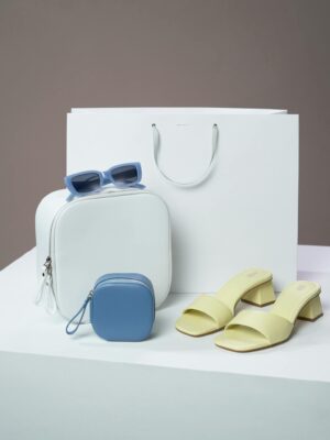 Stylish display of fashion accessories including sandals and sunglasses for a modern look.